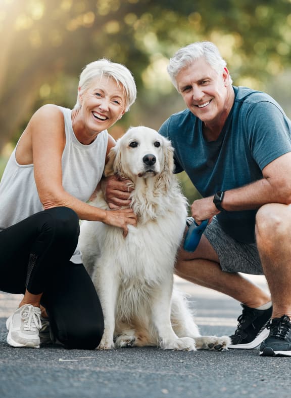an older couple with their dog