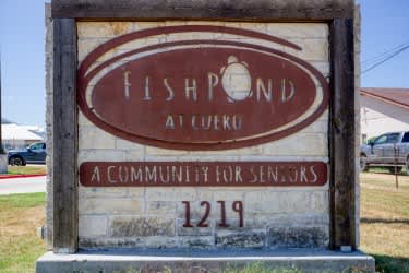 A sign for Fishpond AI Lueko, a community for seniors, is displayed.