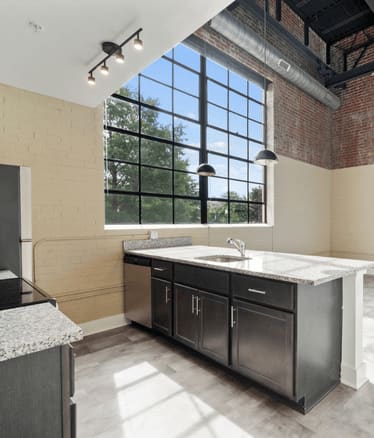 a kitchen with a sink and a window