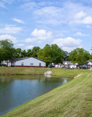 View of green space and lake at Shady Oak Village - Senior Living Apartments, 1101 Shady Oak Ct, Terre Haute