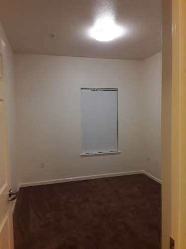 Image of bedroom with carpet and window