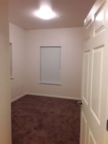 Image of bedroom with carpet and window