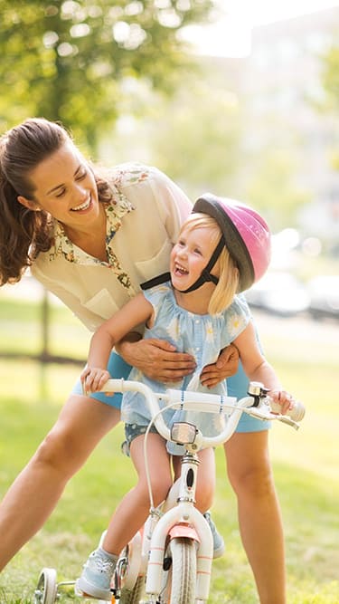 Mom and daughter with bike  at Bonita Pointe, Florida City