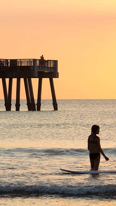 Lifestyle photo of pier and beach at sunset at Indian Trace, West Palm Beach, FL