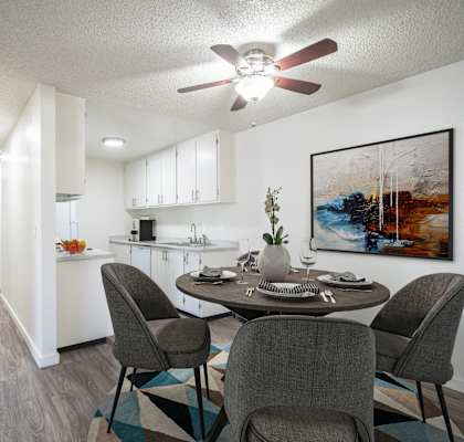 an open kitchen and dining room with a table and chairs