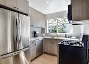 Thumbnail 5 of 18 - a kitchen with a stove and a refrigerator at 8535 Colgate-Fully Furnished Apartments, Los Angeles, California