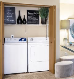 a laundry room with a washer and dryer