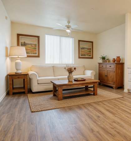 A living room with a couch, a coffee table, and a lamp.