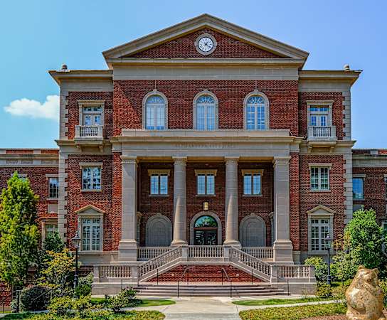 a large brick building with a large clock on the top of it at Emblem Alpharetta, Alpharetta, GA, 30009