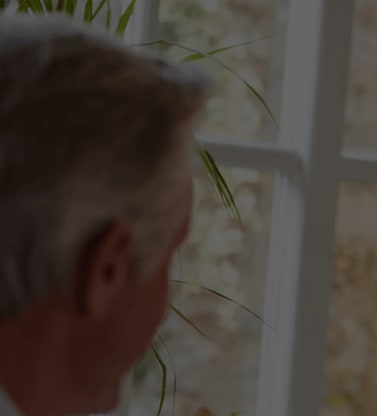 A man with gray hair dining at a nice restaurant