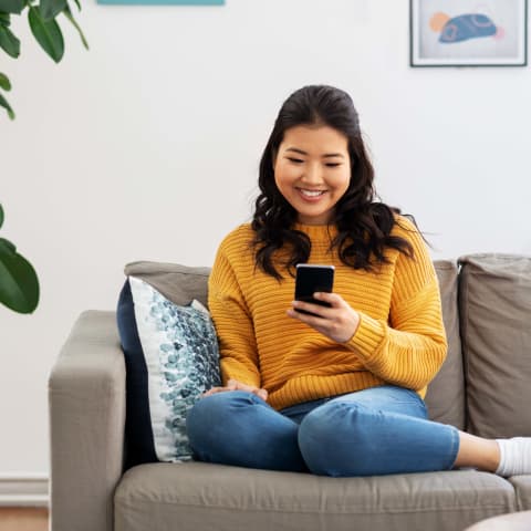 Woman on couch on phone