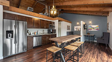 a kitchen with a refrigerator freezer next to a table