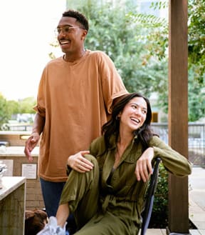 Couple smiling at outdoor table