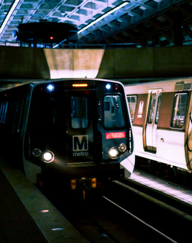 a metro train pulling into a station