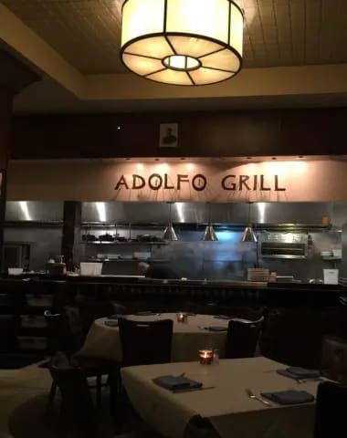 the adolfo grill in the dining room of a restaurant