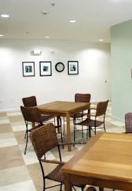 A conference room with a table and chairs.