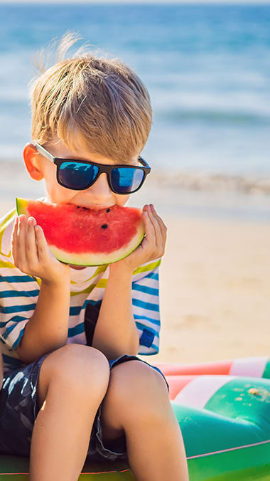Child eating watermelon   at Bay Winds, Miami, 33161