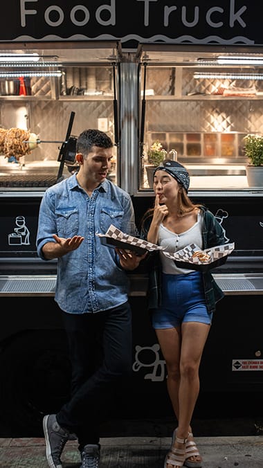 Couple at a food truck  at Bay Winds, Florida