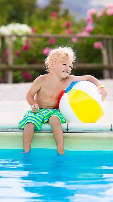 Lifestyle photo of child at the pool at Marbrisa Apartments, Miami Gardens