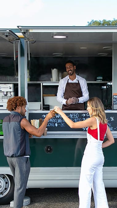 Couple at a food truck at Hibiscus Pointe, Miami, FL