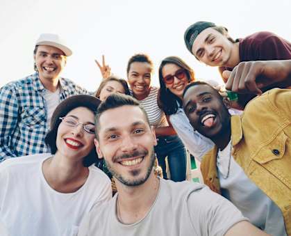 A group of people are taking a selfie together.