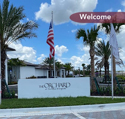 a welcome sign for the orchid resort in key largo