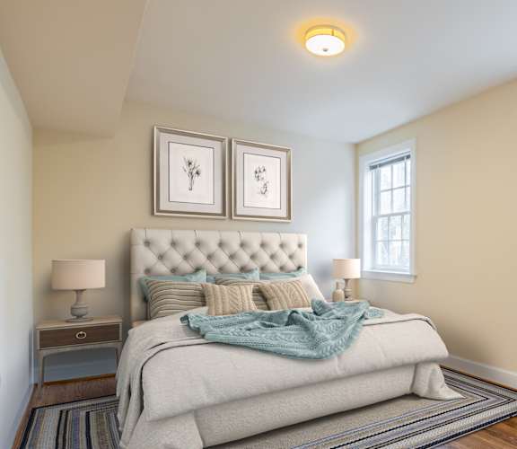 Apartment bedroom furnished with bed and night stand-Clarendon Court Apartments, Arlington, VA