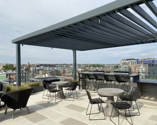 a roof top bar with a view of the city at Tribeca, District of Columbia