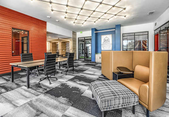 a conference room with chairs and tables and a couch at The Overlook in Winter Garden, FL