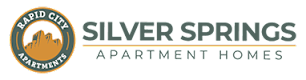 The image is a logo for Silver Springs Apartments.