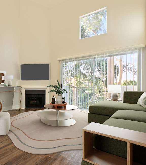 a living room with a spiral staircase and a couch and a table at Playa Summit, Los Angeles, CA
