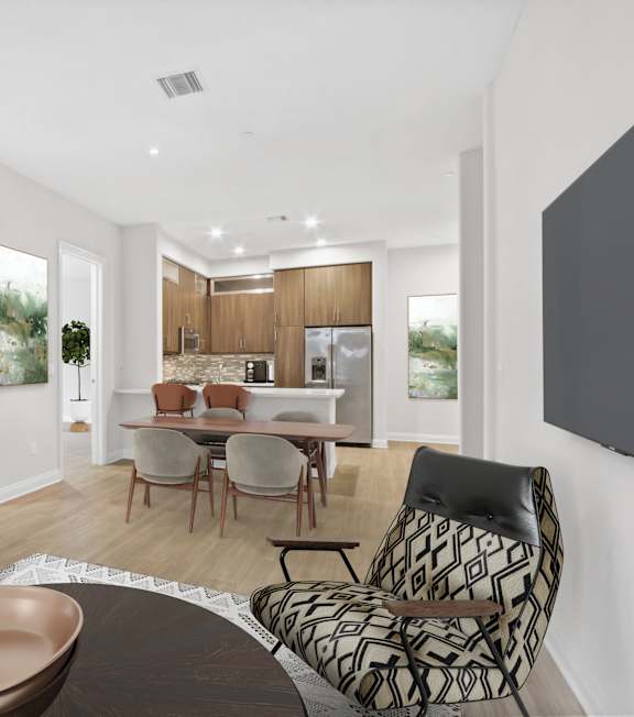 a living room with a spiral staircase and a couch and a table at The Adler Apartments, Los Angeles, CA