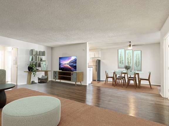A living room with a television, a dining table, and chairs at Rose Apartments, Los Angeles, CA