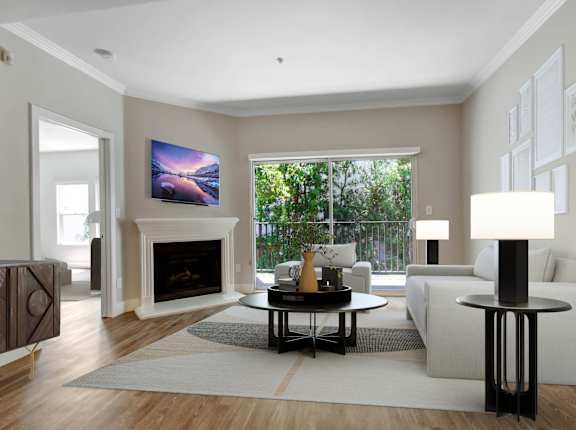 A modern living room with a fireplace and a painting on the wall at Toluca Court, California