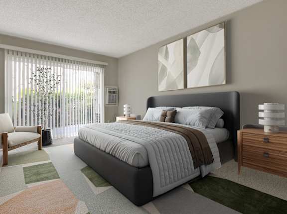 A bedroom with a large bed and a chair by the window at Waverly, Los Angeles, CA