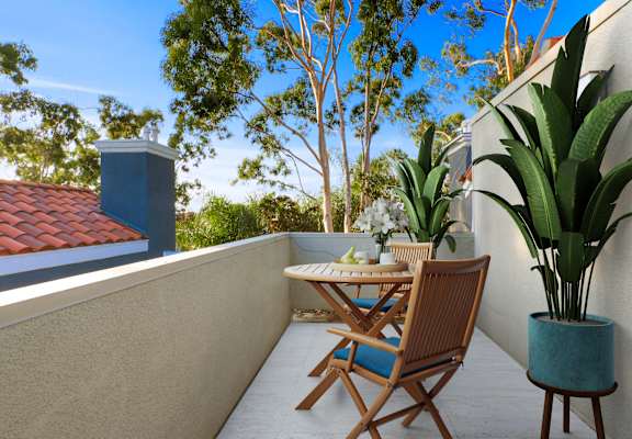 a patio with a table and chairs on a balcony at Playa Summit, Los Angeles, California