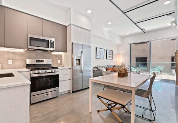 a kitchen and dining area in a 555 waverly unit