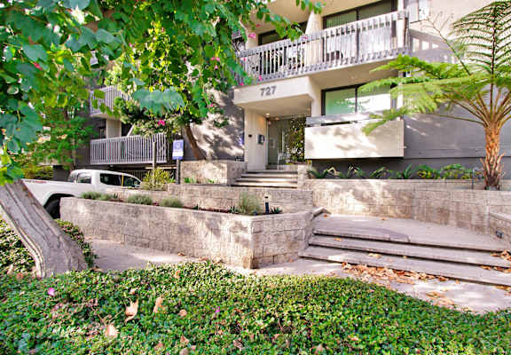 the stairs up to the entrance of an apartment building