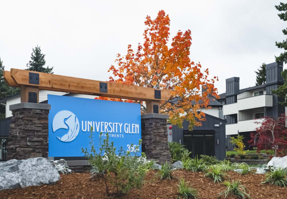 a blue University Glen sign in front of a building