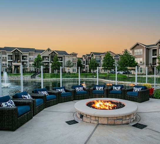 Cozy Outdoor Lounge with a Firepit at Apartment Community in Houston 77077