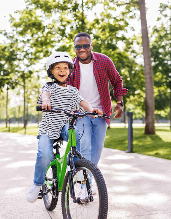 a man and a child riding a bike at Carmel Vista, Georgia, 30253