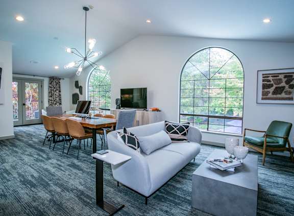a living room with a fireplace and a sliding glass door