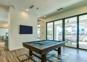Thumbnail 38 of 49 -  pool room with pool table and television at Imperial Crossing Luxury Apartment Homes, Bonita Springs, FL, 34134