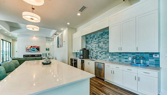 a kitchen with white cabinets and a white counter top at Imperial Crossing Luxury Apartment Homes, Bonita Springs, FL, 34134
