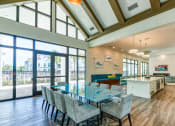 Thumbnail 35 of 49 - a dining room with a long table and chairs at Imperial Crossing Luxury Apartment Homes, Bonita Springs, FL, 34134