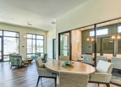 Thumbnail 37 of 49 - a large room with tables and chairs and windows at Imperial Crossing Luxury Apartment Homes, Bonita Springs, FL, 34134