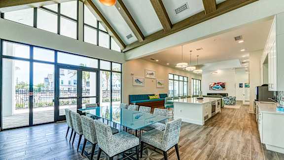 a dining room with a long table and chairs at Imperial Crossing Luxury Apartment Homes, Bonita Springs, FL, 34134
