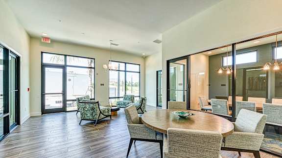 a large room with tables and chairs and windows at Imperial Crossing Luxury Apartment Homes, Bonita Springs, FL, 34134