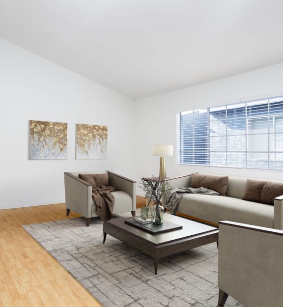 an empty room with white walls and wood floors and a window