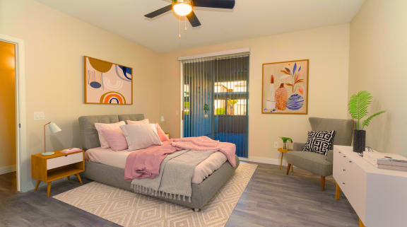 a bedroom with a bed and a ceiling fan